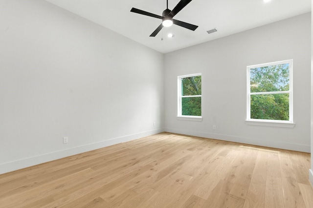 6536 Community Dr, West University Place, TX 77005 - spare room with healthy amount of natural light, light wood-style floors, ceiling fan, and recessed lighting