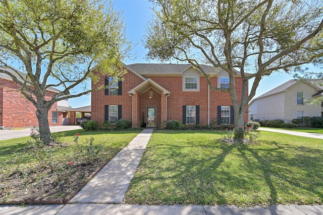 11204 Edwards Ave, Pearland, TX 77584 - traditional-style house featuring brick siding and a front yard