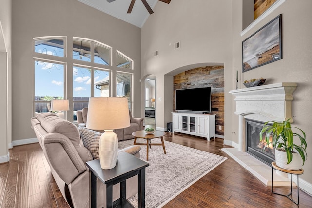 2316 Iron Ridge Ln, Friendswood, TX 77546 - living area featuring high vaulted ceiling, ceiling fan, dark wood finished floors, and visible vents