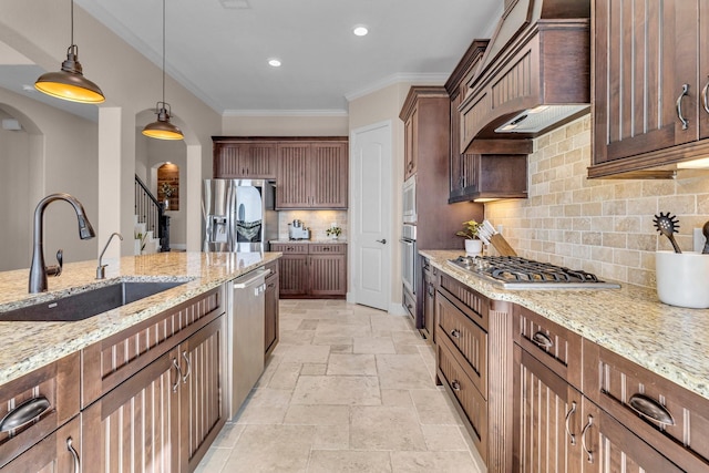2316 Iron Ridge Ln, Friendswood, TX 77546 - kitchen featuring stone tile flooring, arched walkways, light stone counters, a sink, and appliances with stainless steel finishes