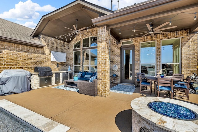 2316 Iron Ridge Ln, Friendswood, TX 77546 - view of patio / terrace with exterior kitchen, a ceiling fan, an outdoor living space, and a grill