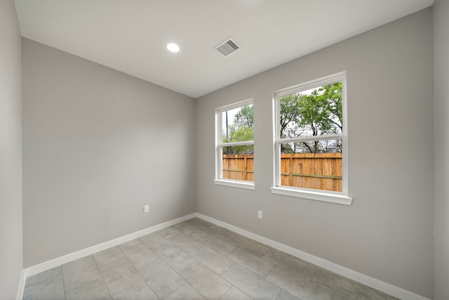 300 Stewart St, Baytown, TX 77520 - spare room featuring baseboards and recessed lighting