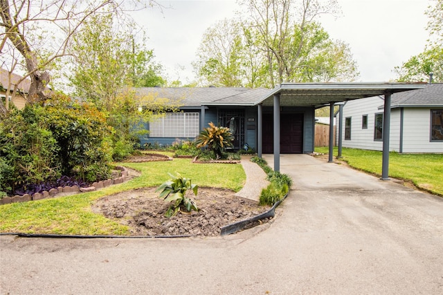 6038 Belcrest St, Houston, TX 77033 - single story home with an attached garage, a carport, a front lawn, and driveway
