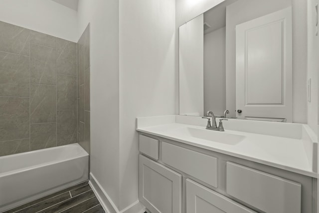 10403 Shining Dawn Way, Richmond, TX 77406 - full bathroom featuring vanity, baseboards, wood finished floors, and shower / bathtub combination