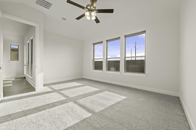 10403 Shining Dawn Way, Richmond, TX 77406 - empty room featuring baseboards, a ceiling fan, carpet flooring, and lofted ceiling