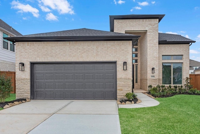 3193 Stingray Cove Dr, Katy, TX 77493 - view of front of home with driveway, an attached garage, and a front lawn