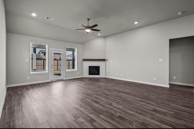 716 Ivory Creek Ct, Willis, TX 77378 - unfurnished living room with ceiling fan, visible vents, a fireplace, baseboards, and dark wood-style floors