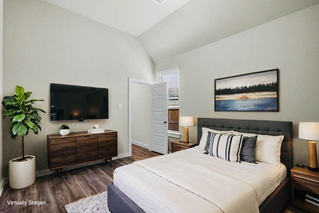 716 Ivory Creek Ct, Willis, TX 77378 - bedroom with baseboards, vaulted ceiling, and wood finished floors