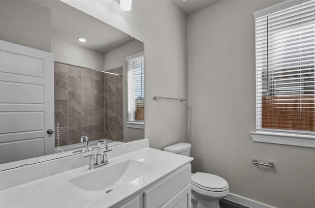 716 Ivory Creek Ct, Willis, TX 77378 - bathroom featuring vanity, baseboards, walk in shower, and toilet