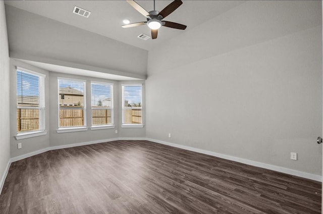 716 Ivory Creek Ct, Willis, TX 77378 - spare room with baseboards, a ceiling fan, dark wood finished floors, and visible vents
