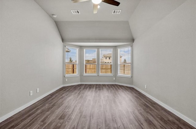 716 Ivory Creek Ct, Willis, TX 77378 - empty room with visible vents, plenty of natural light, and dark wood finished floors