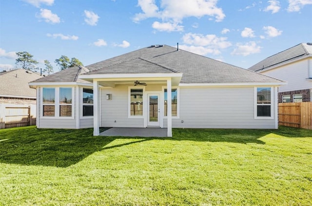716 Ivory Creek Ct, Willis, TX 77378 - rear view of property featuring a lawn, a fenced backyard, ceiling fan, and a patio area