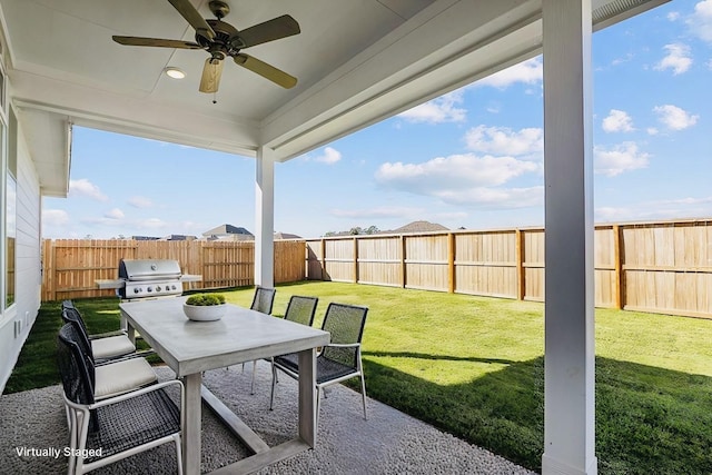 716 Ivory Creek Ct, Willis, TX 77378 - view of patio featuring a fenced backyard, outdoor dining area, ceiling fan, and area for grilling