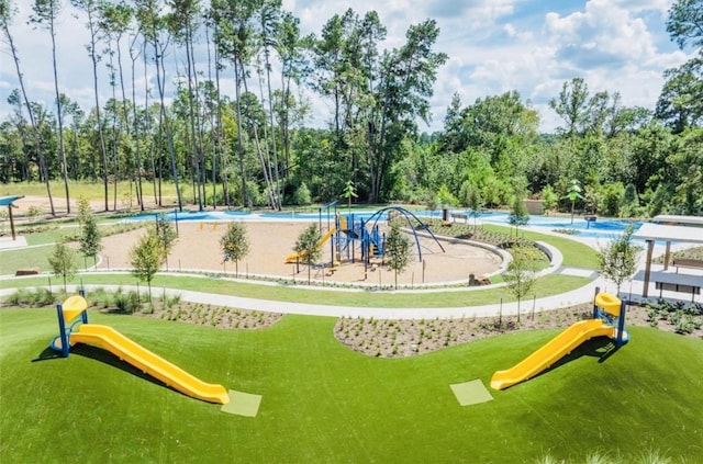 716 Ivory Creek Ct, Willis, TX 77378 - surrounding community with a yard, playground community, and a pool