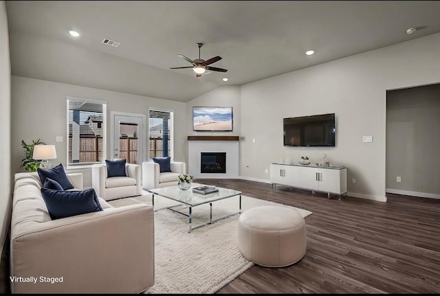 716 Ivory Creek Ct, Willis, TX 77378 - living area featuring baseboards, a ceiling fan, dark wood-style floors, and visible vents