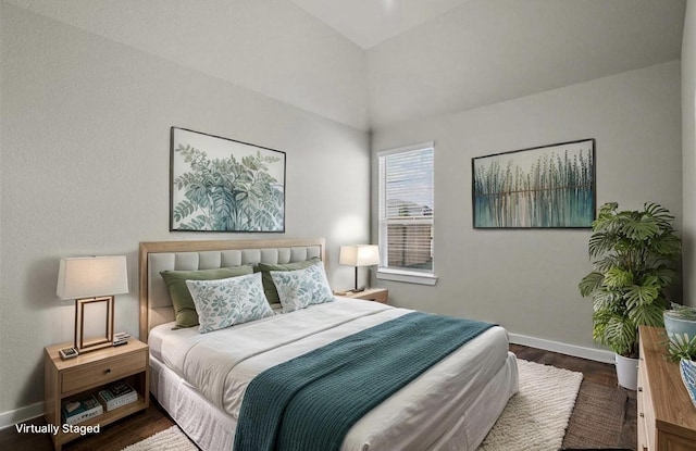 716 Ivory Creek Ct, Willis, TX 77378 - bedroom with baseboards and wood finished floors
