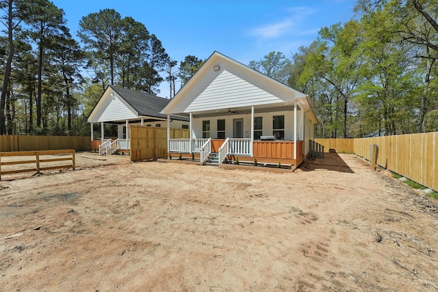 200 Canary St, Point Blank, TX 77364 - back of property with ceiling fan, a fenced backyard, and a porch