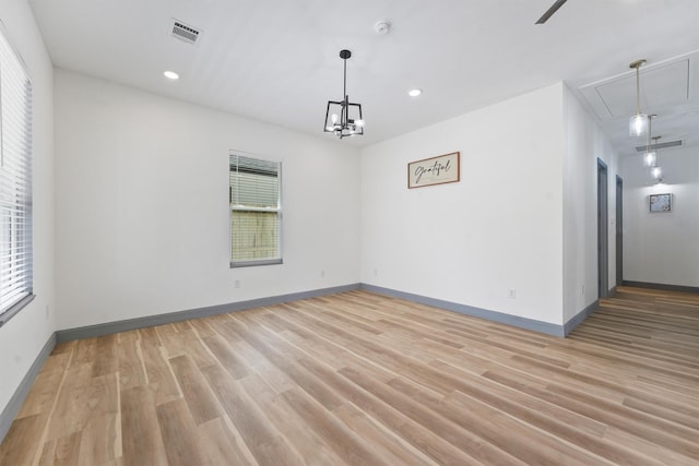 200 Canary St, Point Blank, TX 77364 - unfurnished room with attic access, light wood finished floors, baseboards, recessed lighting, and a smoke detector