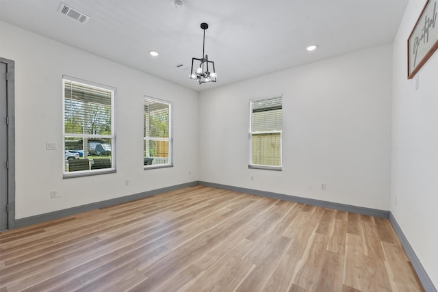 200 Canary St, Point Blank, TX 77364 - empty room featuring light wood-style flooring, a chandelier, recessed lighting, and baseboards