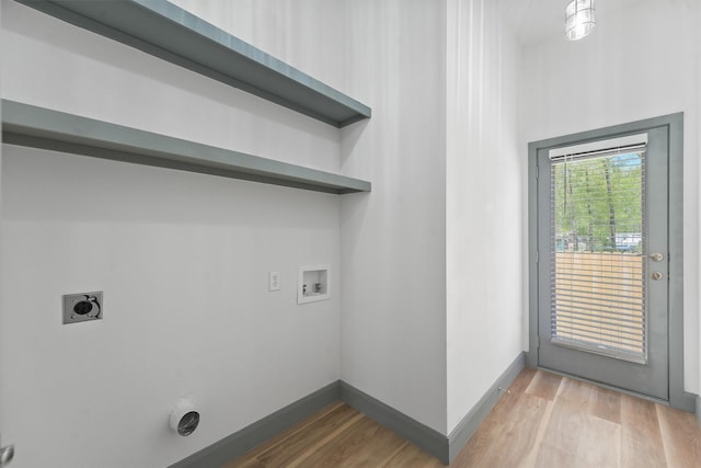 200 Canary St, Point Blank, TX 77364 - laundry area featuring electric dryer hookup, washer hookup, light wood-style floors, and baseboards