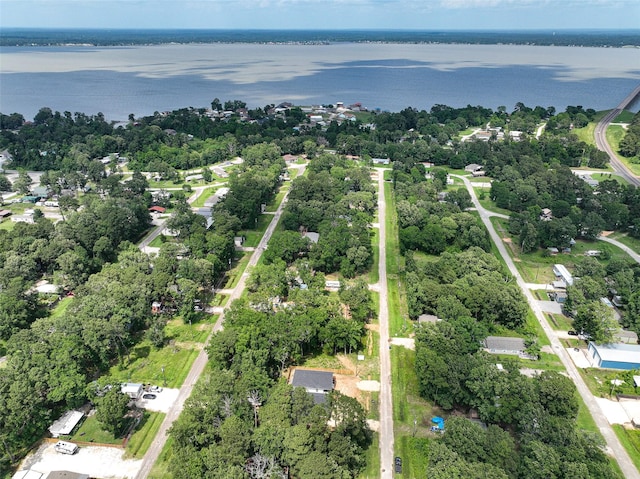 200 Canary St, Point Blank, TX 77364 - aerial view of property's location with a nearby body of water and a tree filled landscape