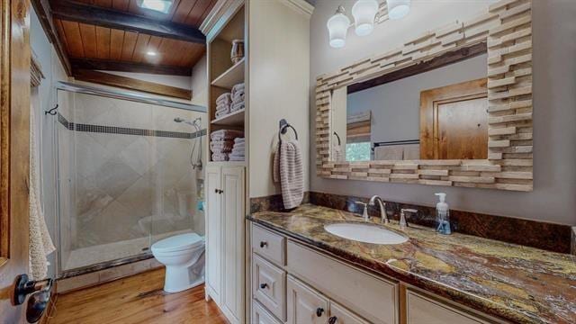 full bathroom featuring toilet, a stall shower, wooden ceiling, and wood finished floors