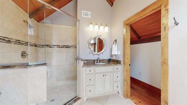 full bathroom with lofted ceiling with beams, visible vents, a stall shower, and wood ceiling