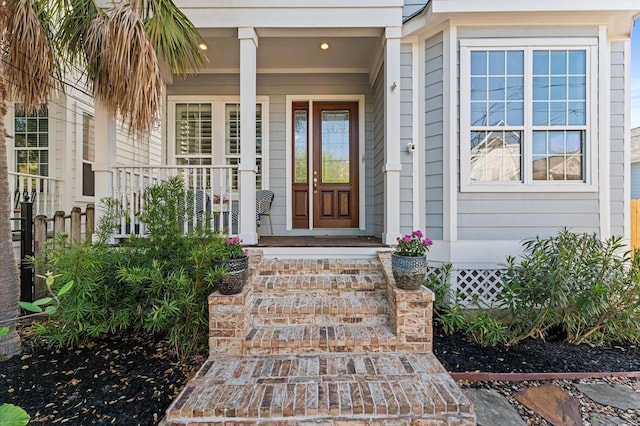 property entrance featuring a porch