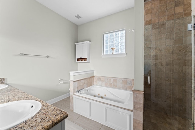 full bath featuring a jetted tub, a sink, a shower stall, tile patterned flooring, and visible vents