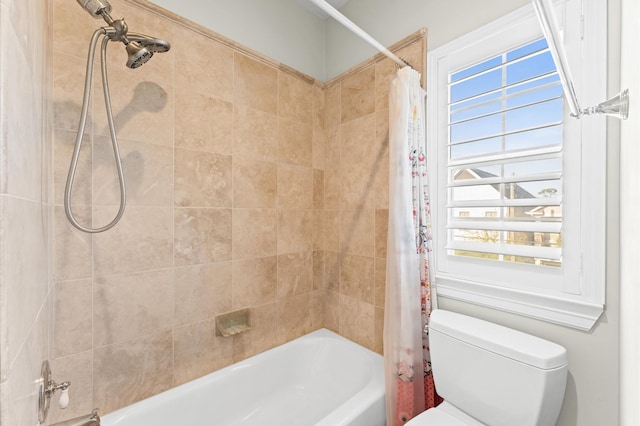 full bathroom featuring shower / bath combo and toilet