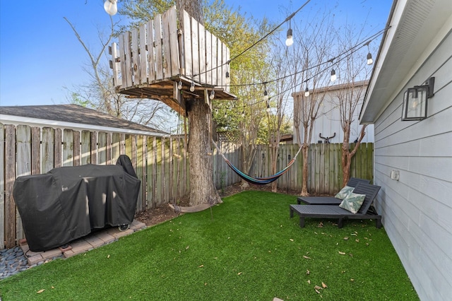view of yard with a fenced backyard