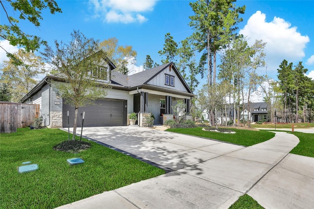 325 Bromley Square Dr, Montgomery, TX 77316 - view of front of house with a garage, a porch, a front yard, fence, and driveway