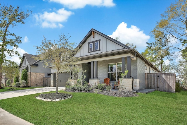 325 Bromley Square Dr, Montgomery, TX 77316 - craftsman-style home with board and batten siding, driveway, a front yard, and brick siding