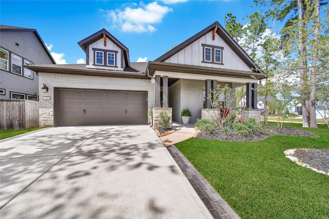 325 Bromley Square Dr, Montgomery, TX 77316 - craftsman-style house featuring a front yard, an attached garage, covered porch, brick siding, and driveway