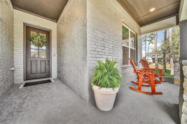 325 Bromley Square Dr, Montgomery, TX 77316 - property entrance featuring covered porch and brick siding