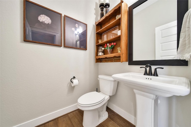 325 Bromley Square Dr, Montgomery, TX 77316 - bathroom with toilet, wood finished floors, and baseboards