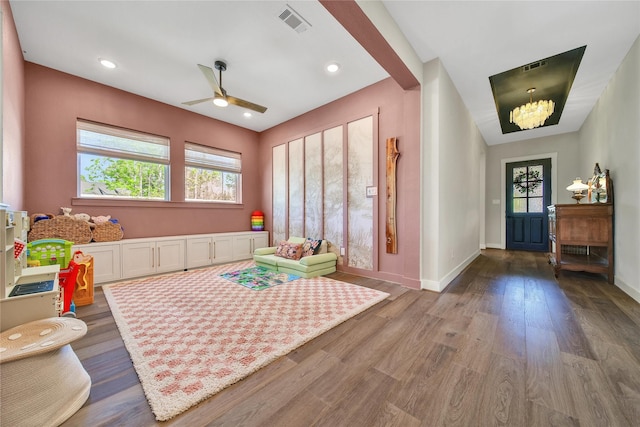 325 Bromley Square Dr, Montgomery, TX 77316 - rec room featuring wood finished floors, ceiling fan with notable chandelier, baseboards, and visible vents