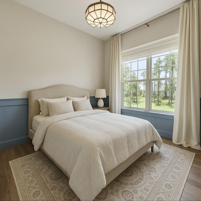 325 Bromley Square Dr, Montgomery, TX 77316 - bedroom with wood finished floors and wainscoting