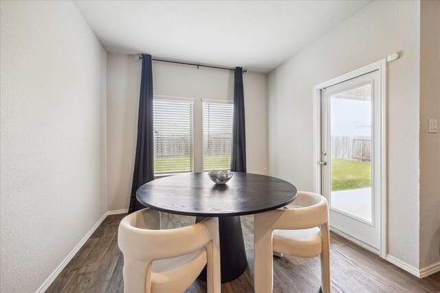 21338 Montclair Valley Way, Katy, TX 77449 - dining space with dark wood-type flooring, baseboards, and a healthy amount of sunlight
