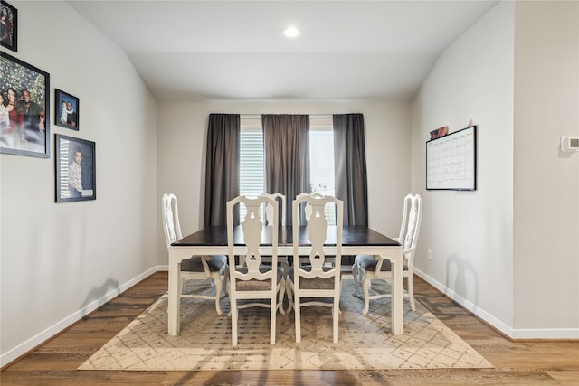 dining space with recessed lighting, baseboards, and wood finished floors