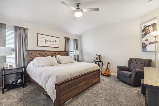 bedroom featuring baseboards, lofted ceiling, light colored carpet, and ceiling fan