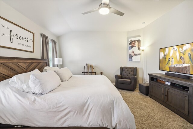 bedroom featuring light carpet, lofted ceiling, and a ceiling fan