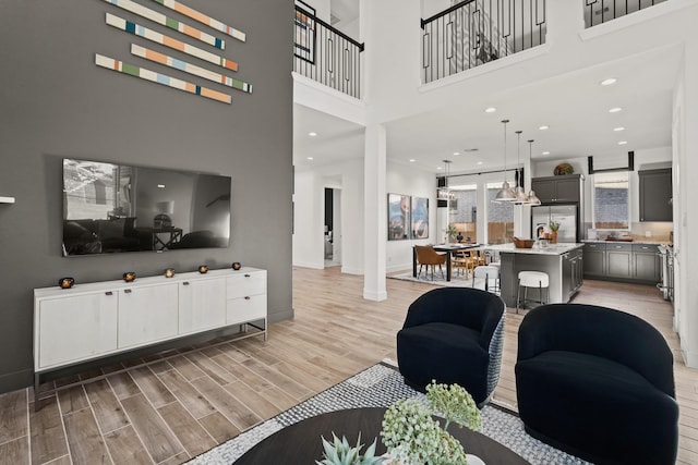 420 Darling Creek Ln, Katy, TX 77493 - living area with light wood-style floors, baseboards, and a high ceiling