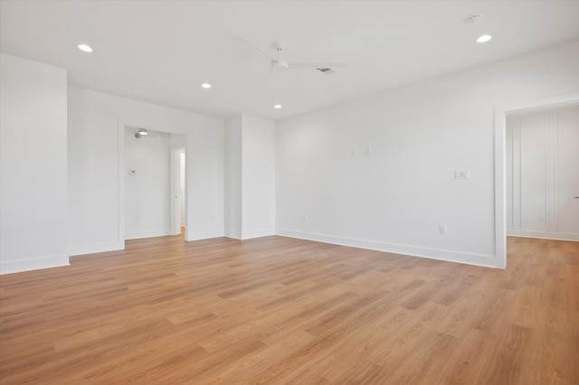 spare room featuring ceiling fan, recessed lighting, light wood-style flooring, and baseboards