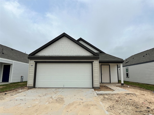 view of front facade with driveway and a garage