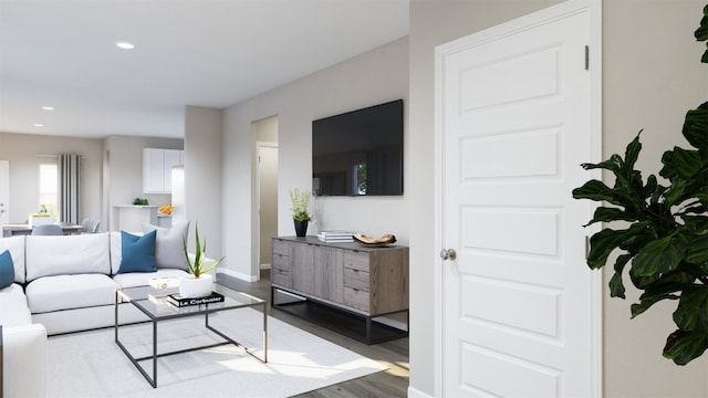 living area with recessed lighting, baseboards, and wood finished floors