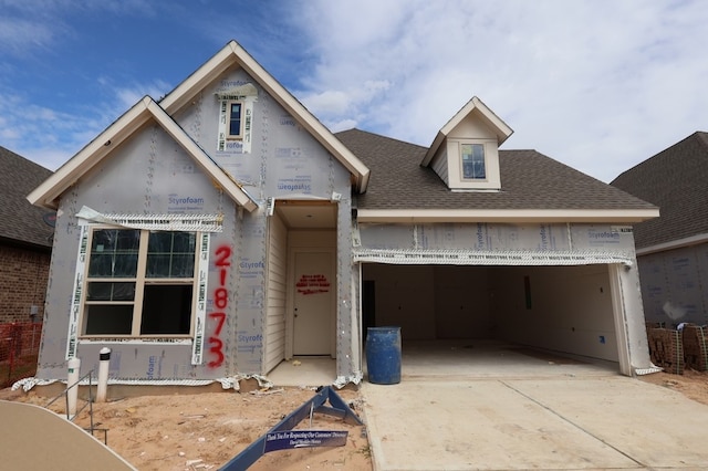 21873 Colorado Bend Ln, Porter, TX 77365 - unfinished property with concrete driveway, an attached garage, and roof with shingles