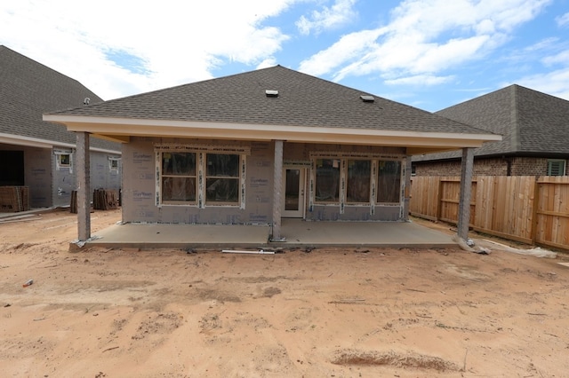 21873 Colorado Bend Ln, Porter, TX 77365 - back of property featuring a patio area and roof with shingles