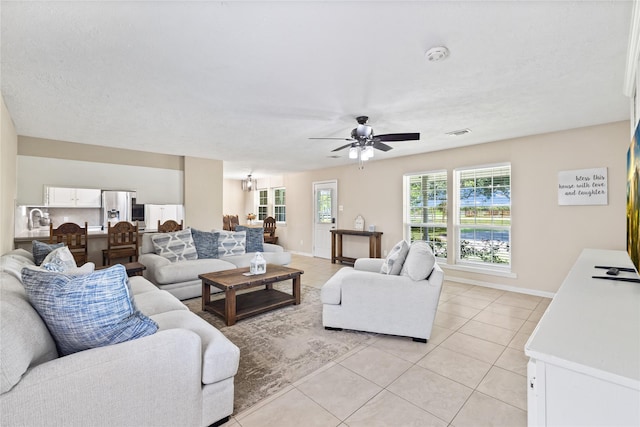3358 County Road 172, Alvin, TX 77511 - living area featuring baseboards, a ceiling fan, visible vents, and light tile patterned floors