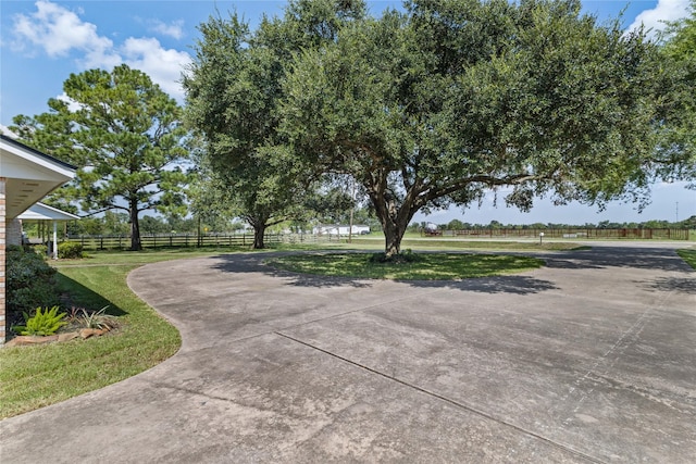 3358 County Road 172, Alvin, TX 77511 - view of property's community featuring driveway, fence, and a yard